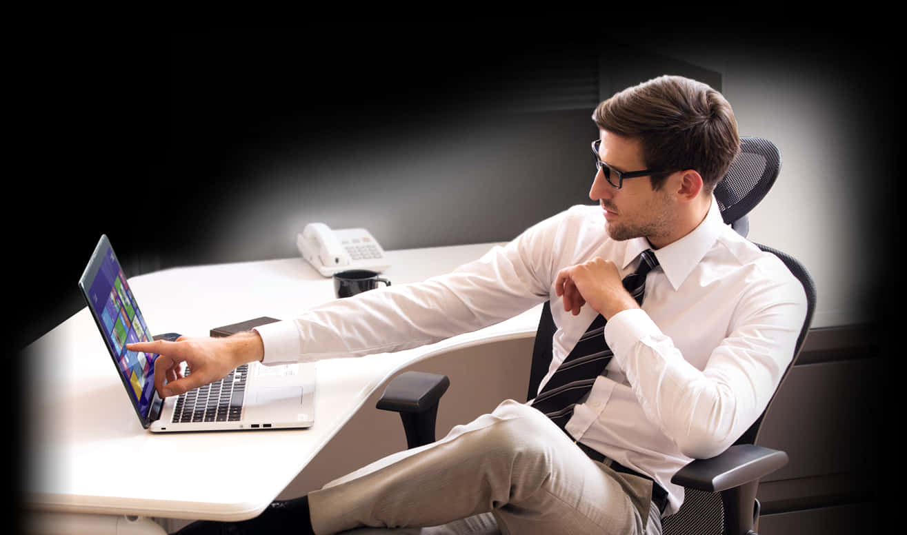 Businessman Using Laptop Office Setting PNG