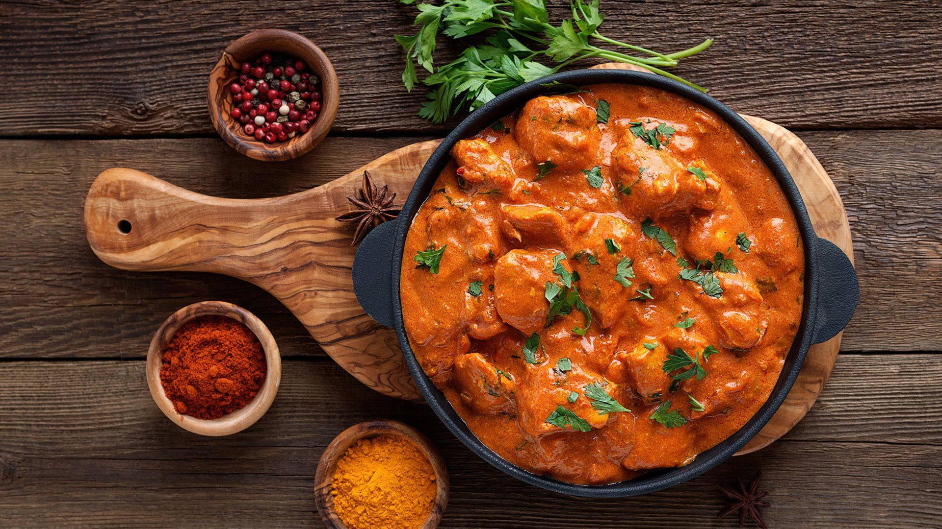Delicious Butter Chicken Served in an Iron Pan Wallpaper