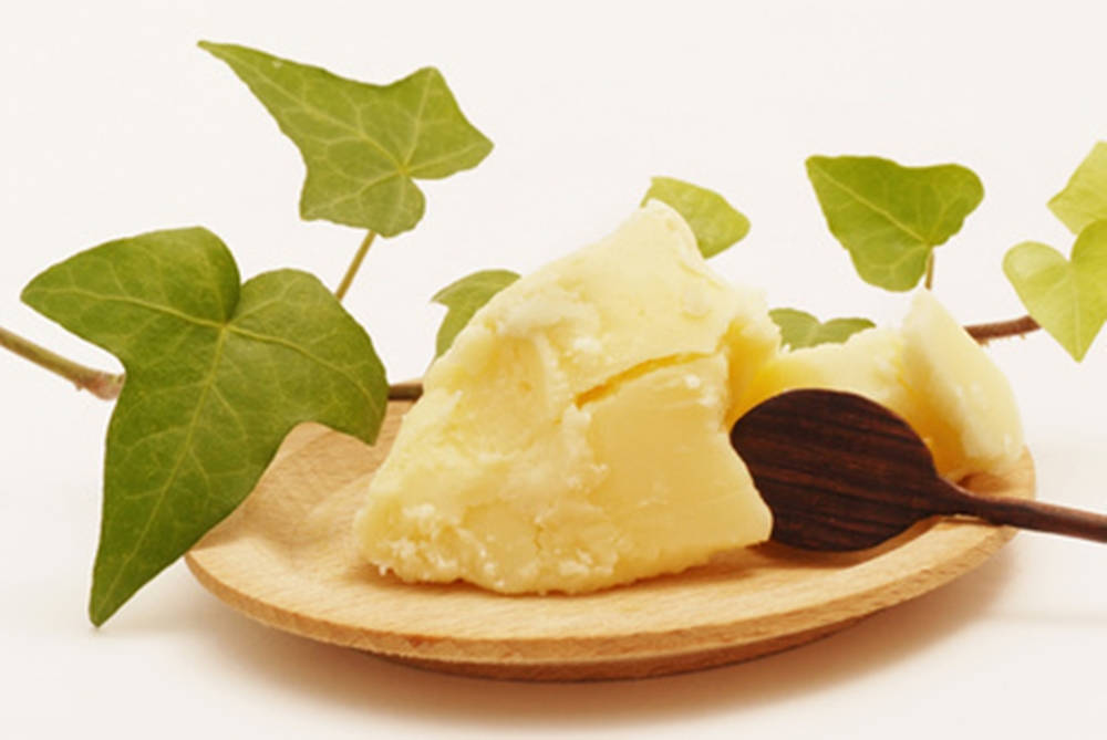 Butter On Wooden Plate With Leaves Wallpaper