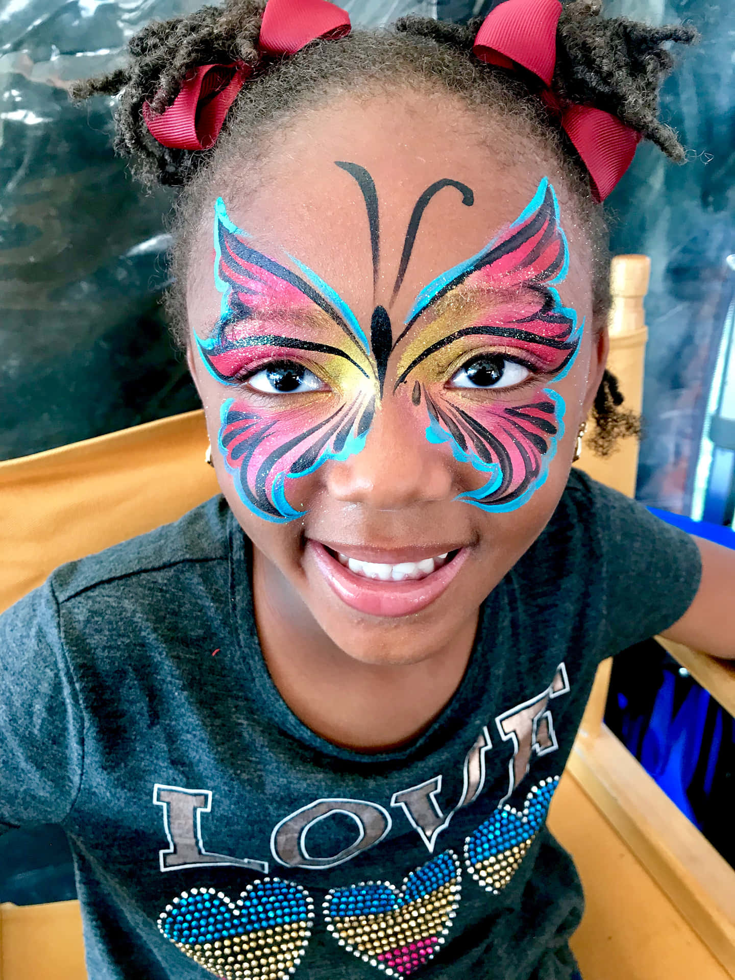 Join In The Fun With Butterfly Face Painting! Wallpaper