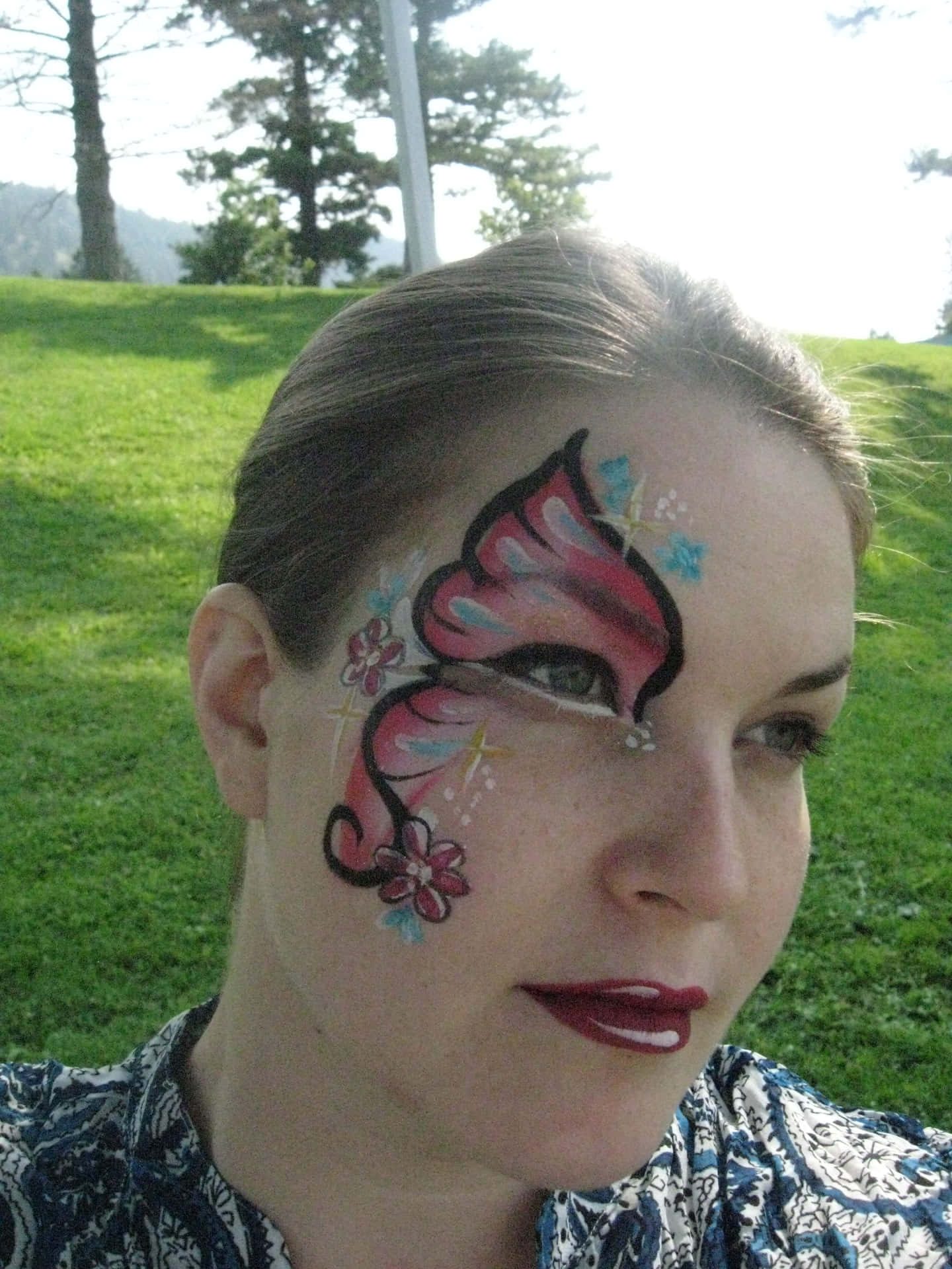 Enhance Your Natural Beauty with Butterfly Face Painting Wallpaper