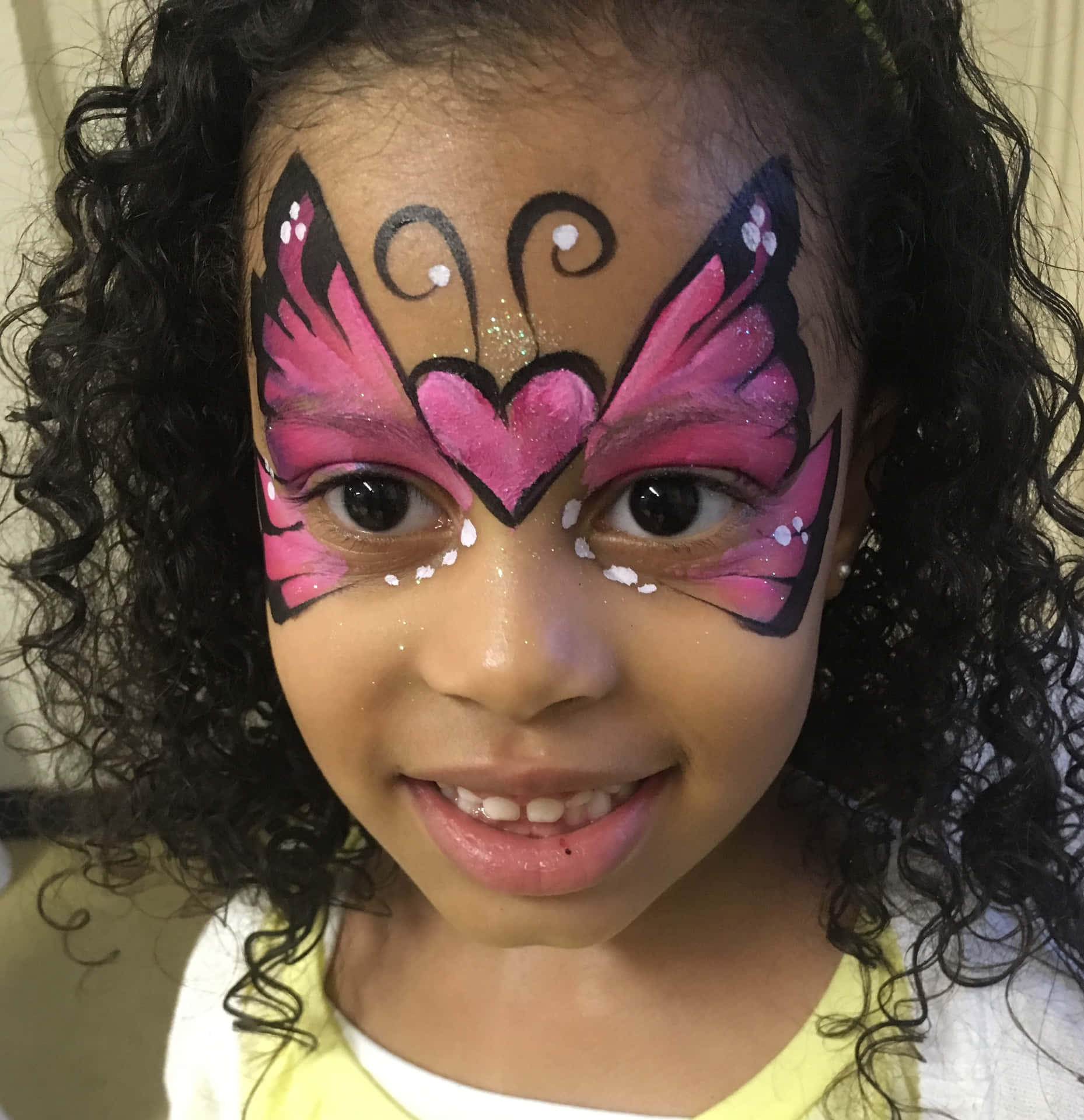 "This simple and vibrant butterfly face painting brings color and joy to your special occasion." Wallpaper