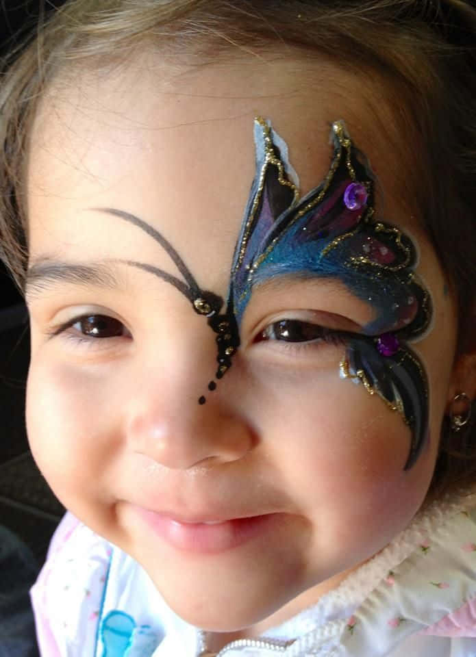 Experience The Magical Transformation Of Butterfly Face Painting Wallpaper