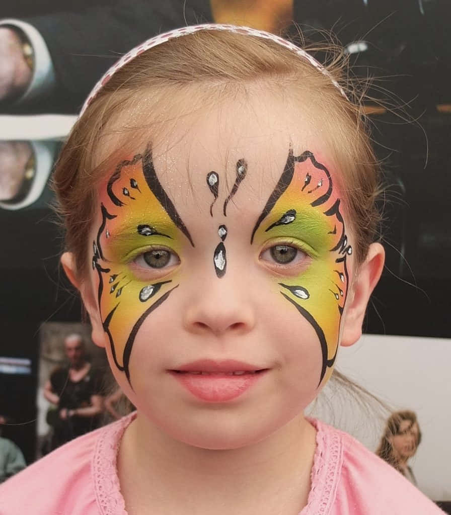 "Enjoying the Joy of Butterfly Face Painting" Wallpaper