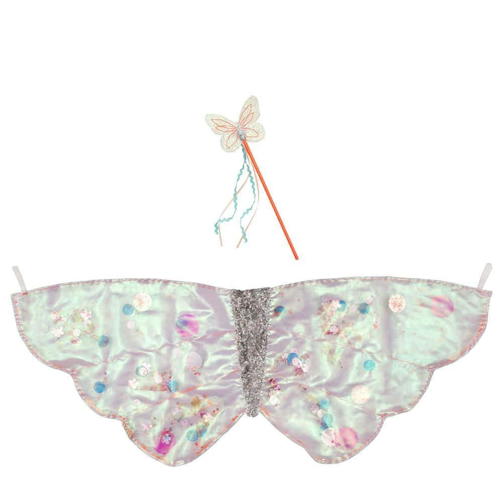 A dazzlingly beautiful model wearing a unique butterfly wing dress Wallpaper