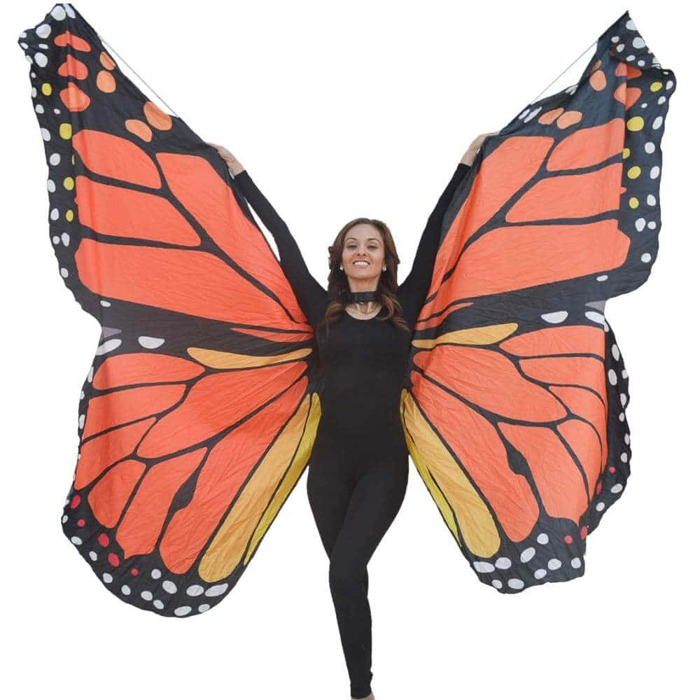 Poised in a dazzling outfit of butterfly wings, this graceful model seems to be suspended in midair. Wallpaper