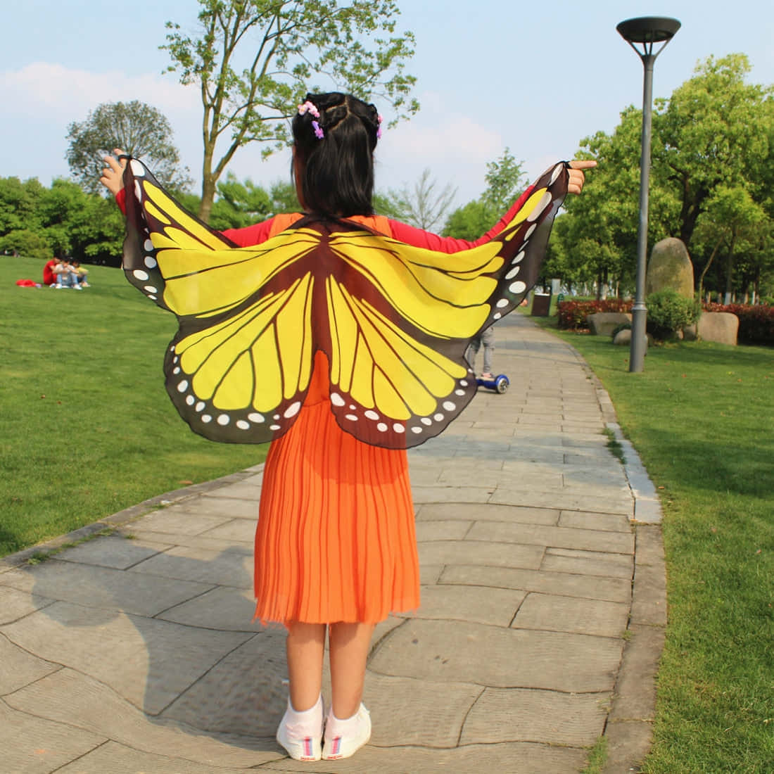 Model in a bold butterfly wing dress Wallpaper