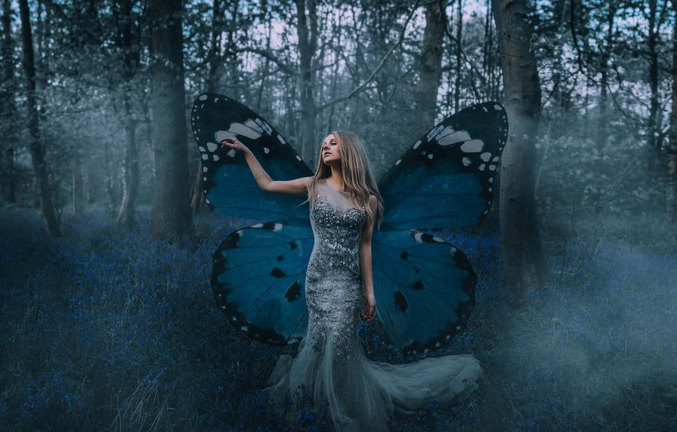 Model wearing a stunning butterfly wing dress Wallpaper