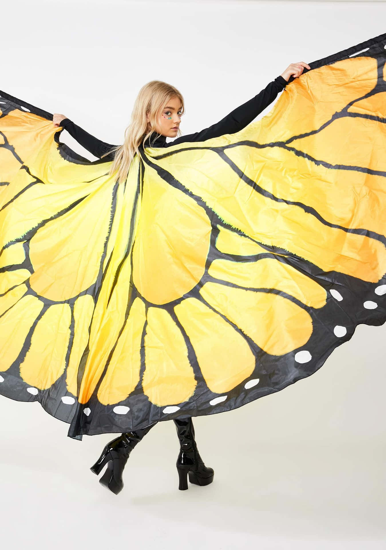 A Butterfly Wing Dress for a Storybook Celebration Wallpaper