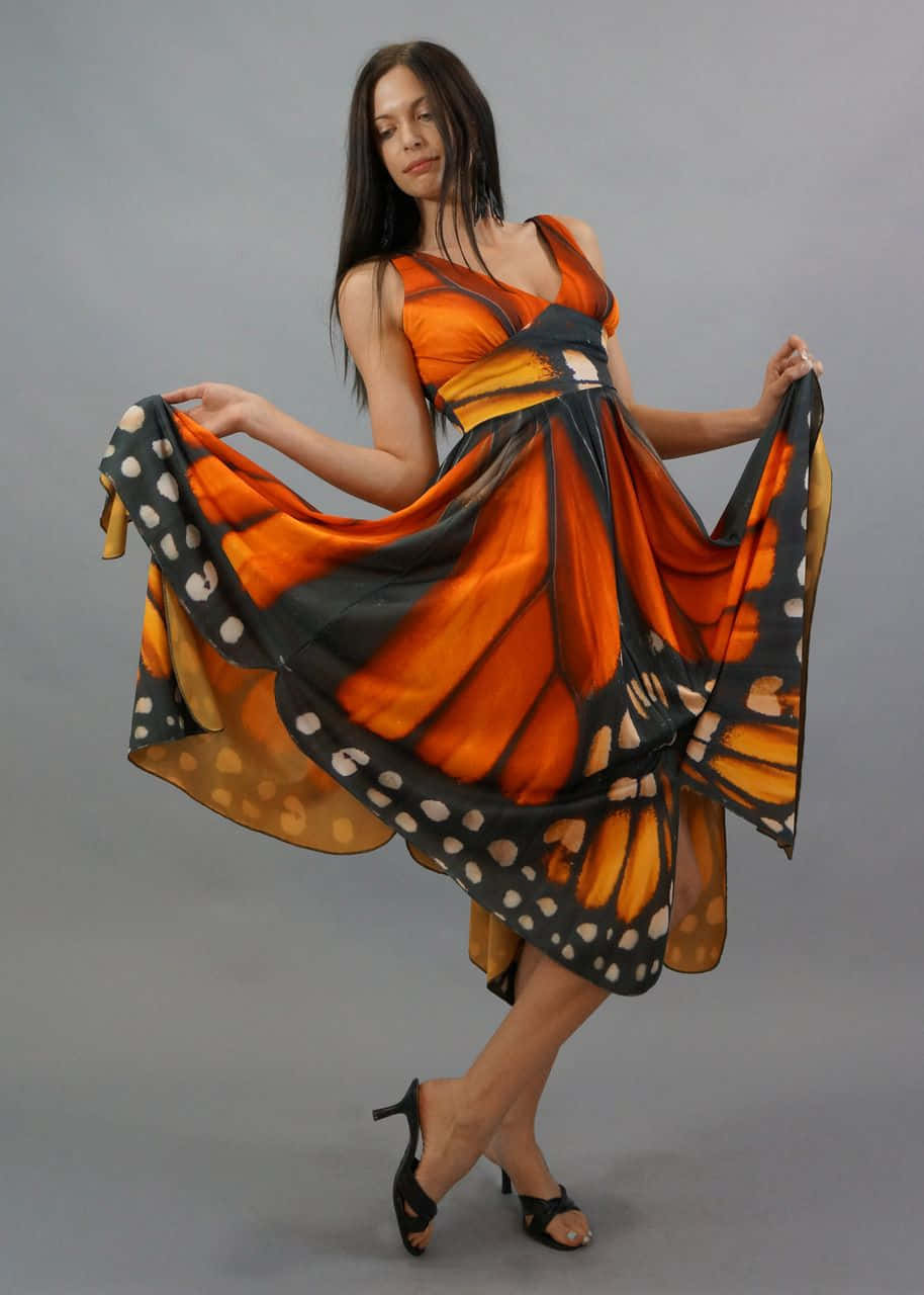 Immerse yourself in the beauty of this unique butterfly wing dress. Wallpaper