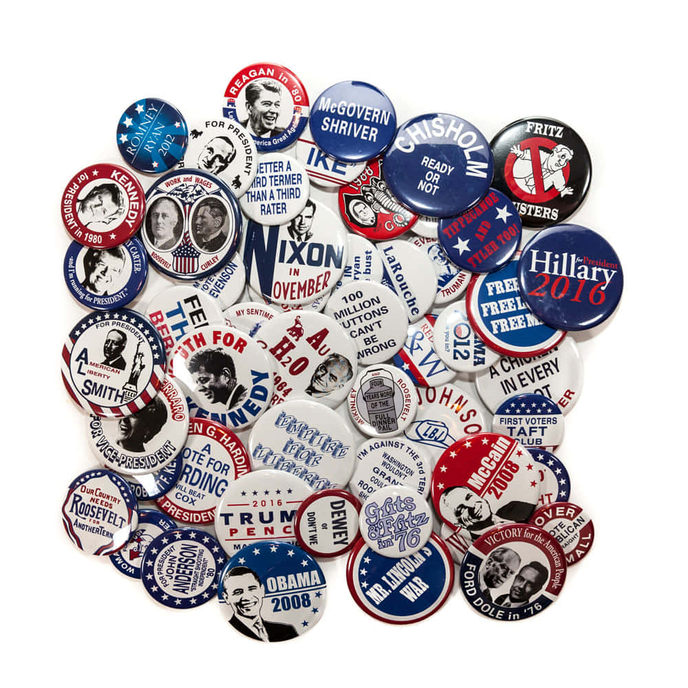 A Pile Of Buttons With Various Political Slogans