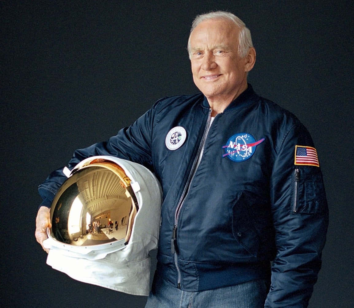 Buzz Aldrin Holding Space Helmet Wallpaper