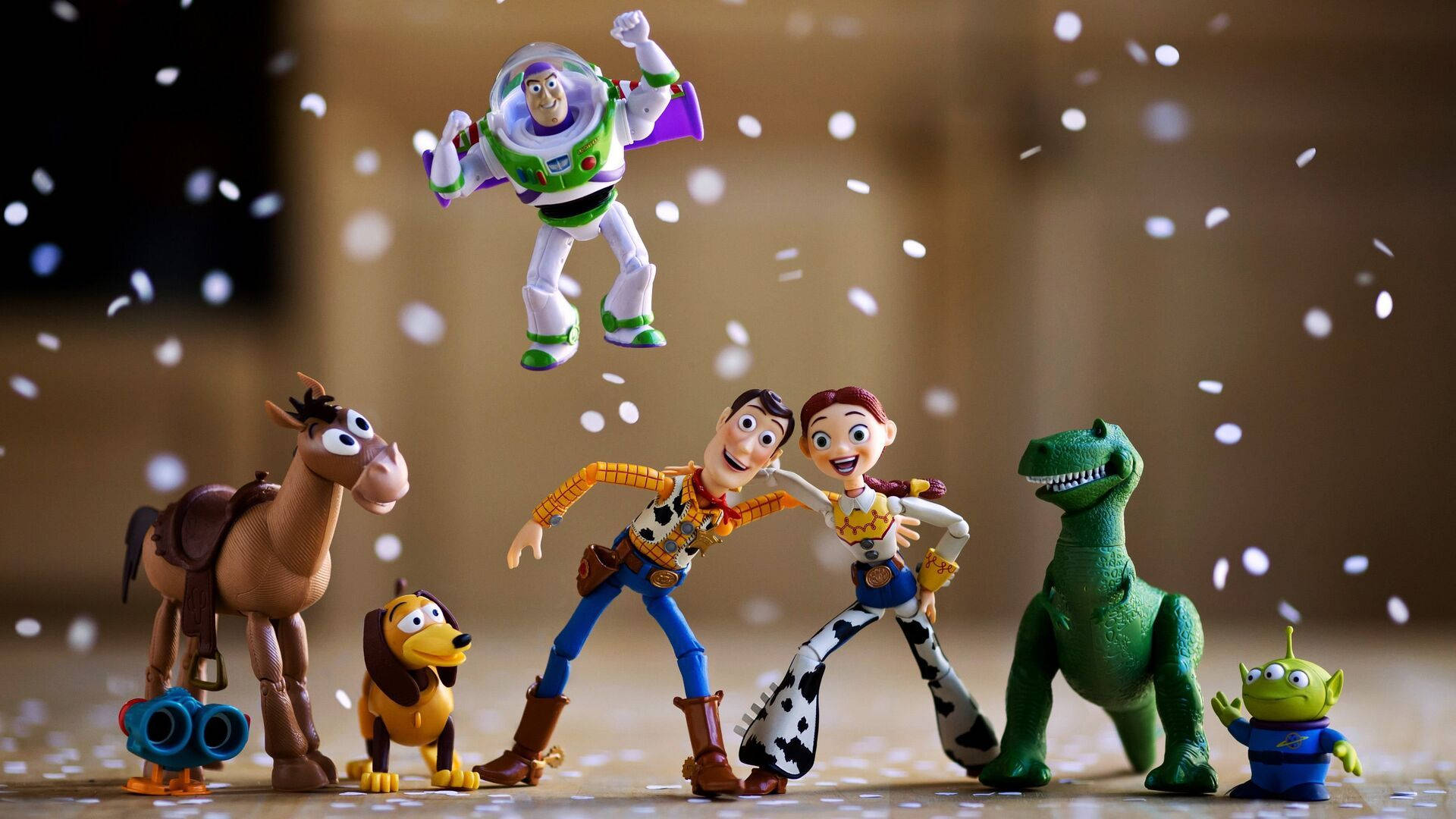 Celebratory Moment with Buzz Lightyear and Friends Wallpaper