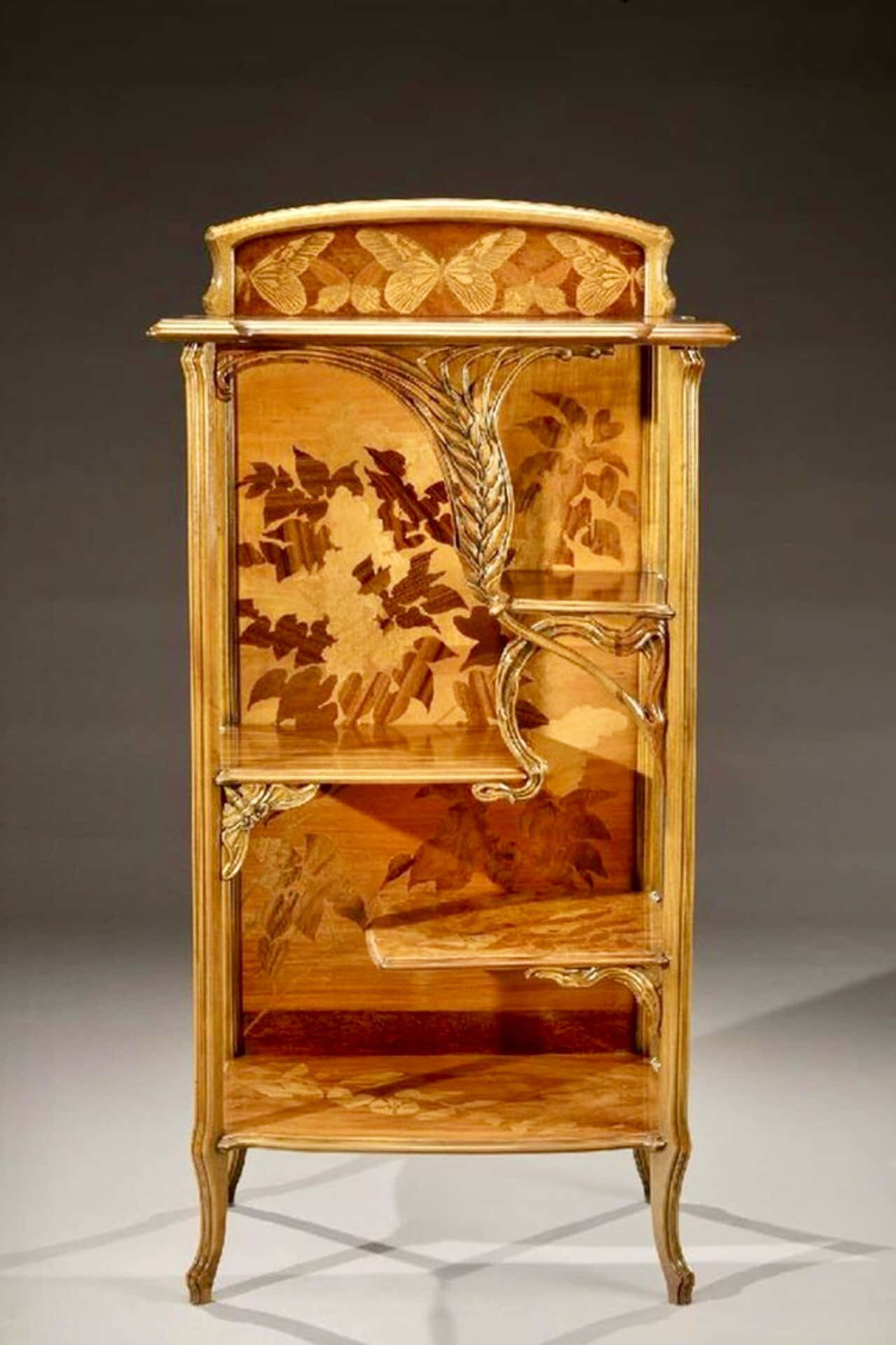 A Wooden Cabinet With A Floral Design On It