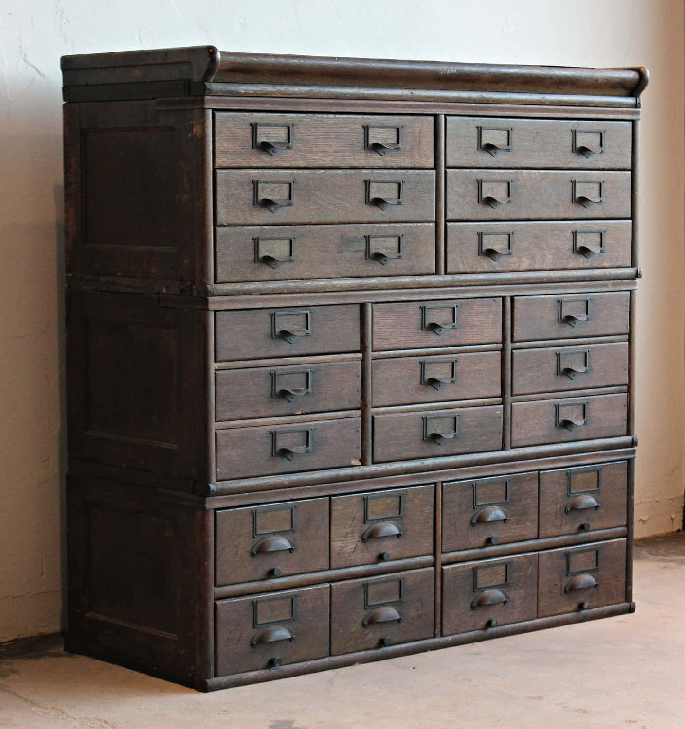 A Large Wooden Cabinet With Drawers