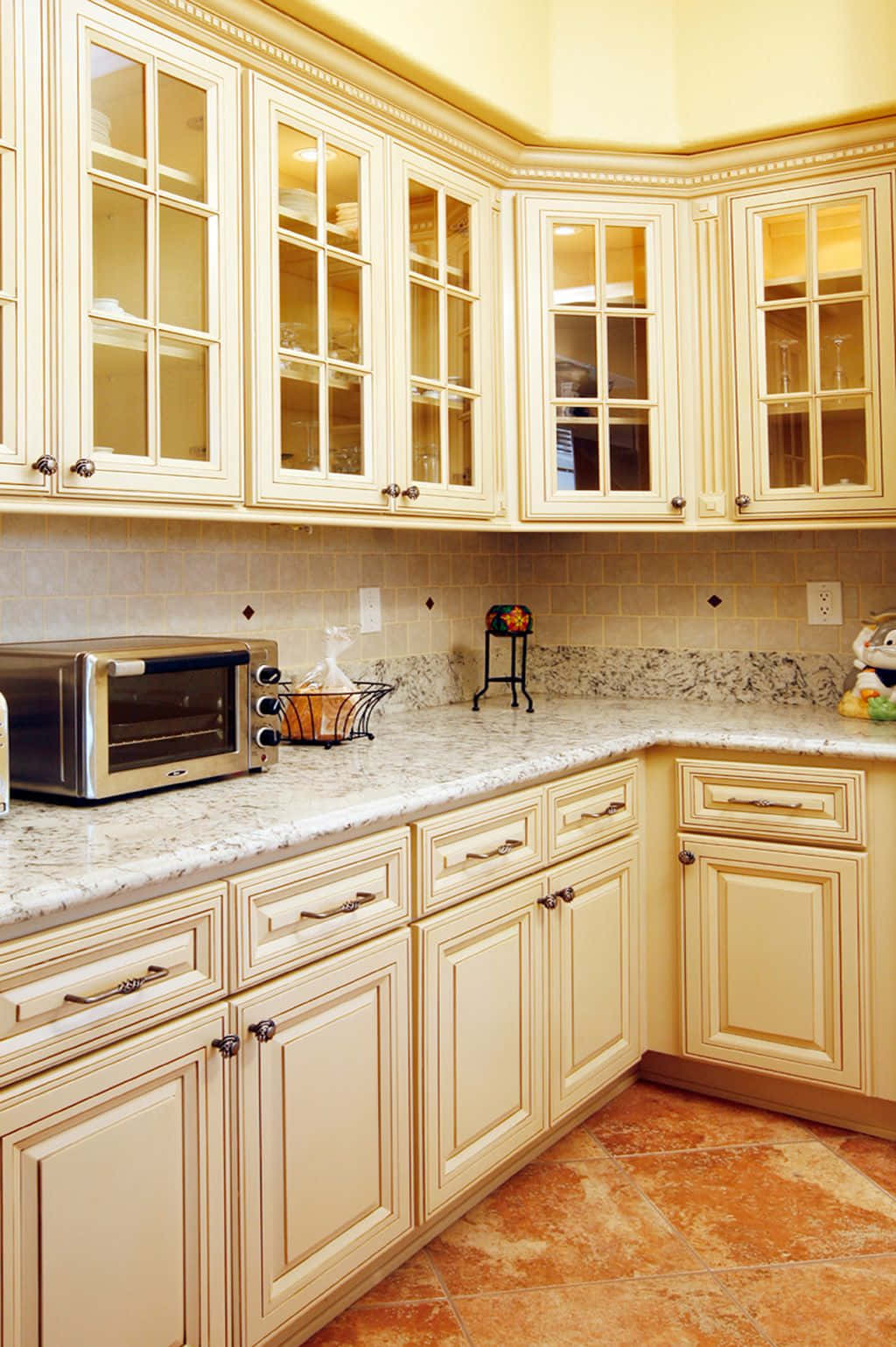 A Kitchen With A Microwave Oven And Cabinets