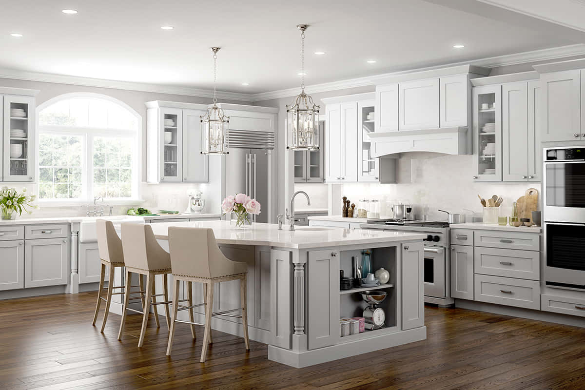 A Kitchen With White Cabinets And A Center Island
