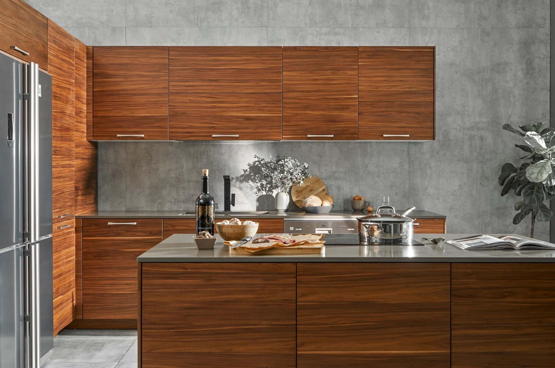 A Kitchen With Wooden Cabinets And A Stainless Steel Refrigerator