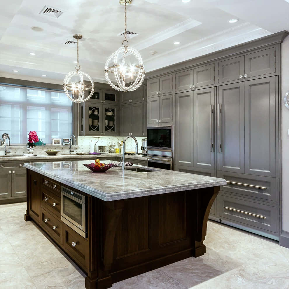 A Kitchen With Gray Cabinets And A Marble Island