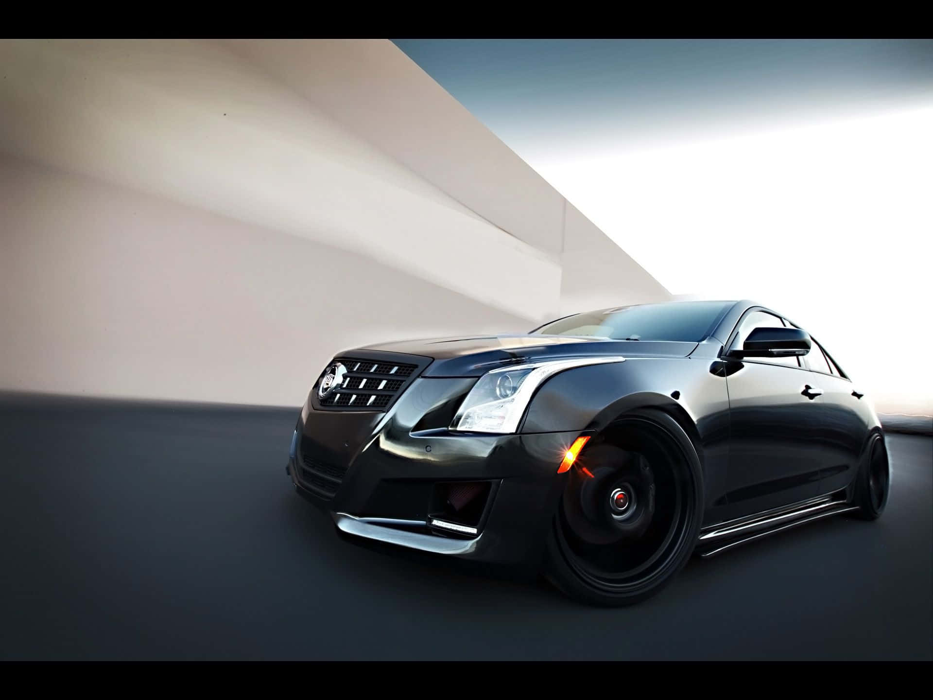 Sleek and Luxurious Cadillac ATS in motion Wallpaper