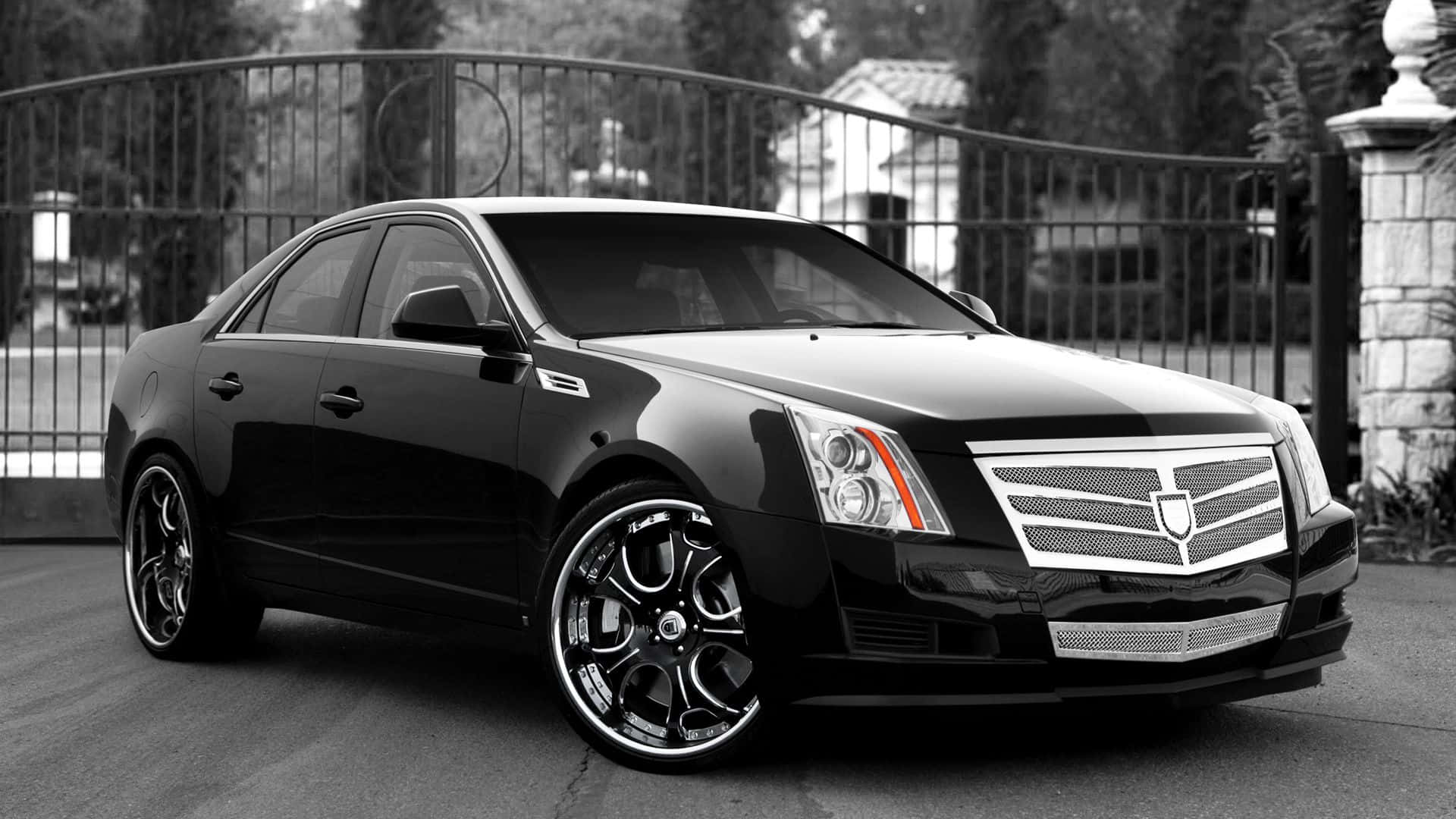 Sleek Black Cadillac CTS on the Road Wallpaper