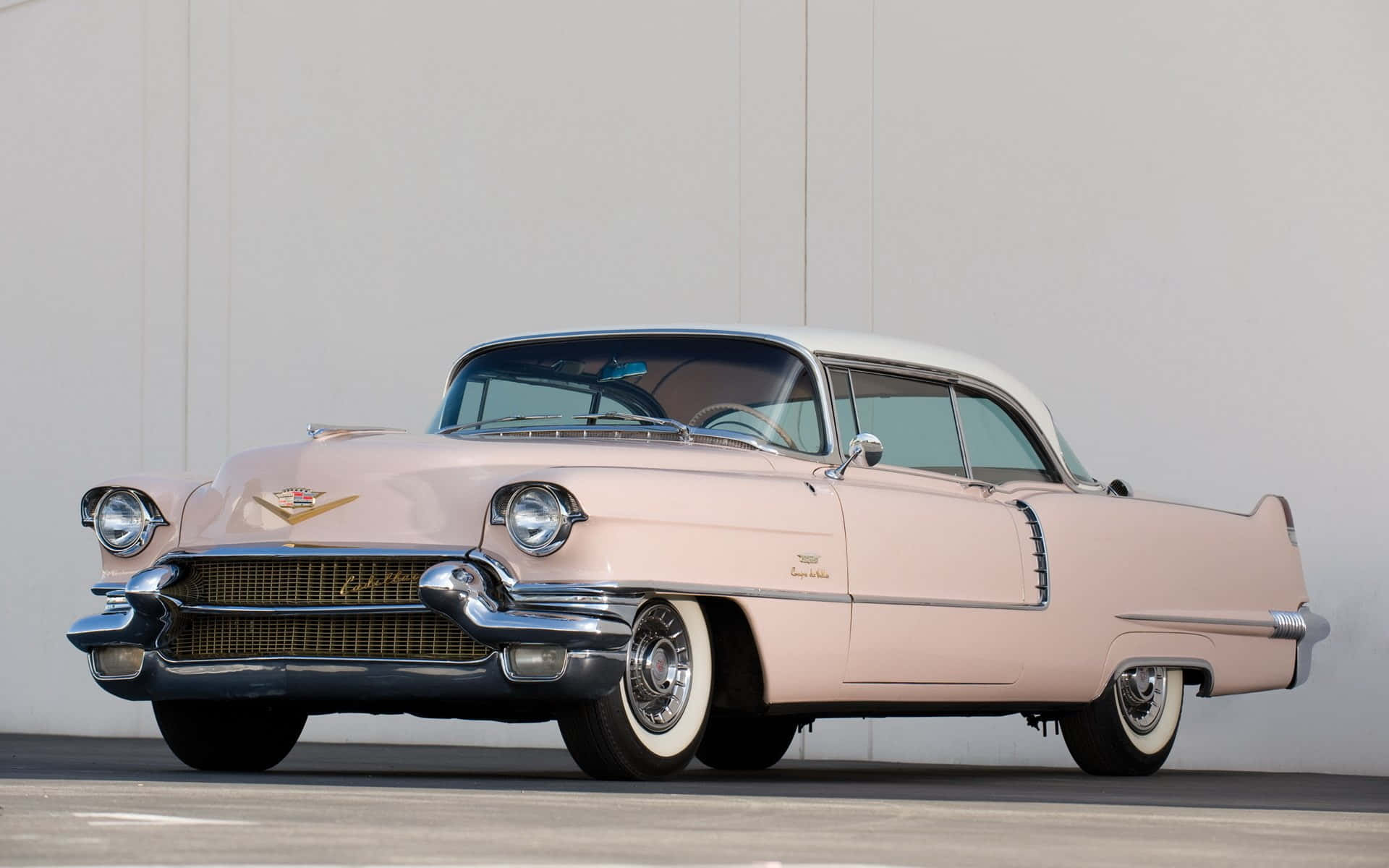 Caption: Classic Luxury: Stunning Cadillac Deville Wallpaper