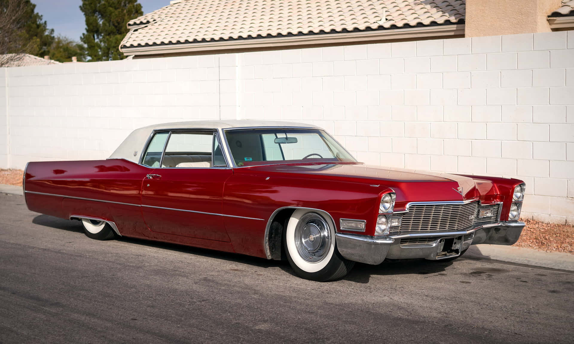 A Stunning Cadillac Deville Wallpaper with Vibrant Colors Wallpaper