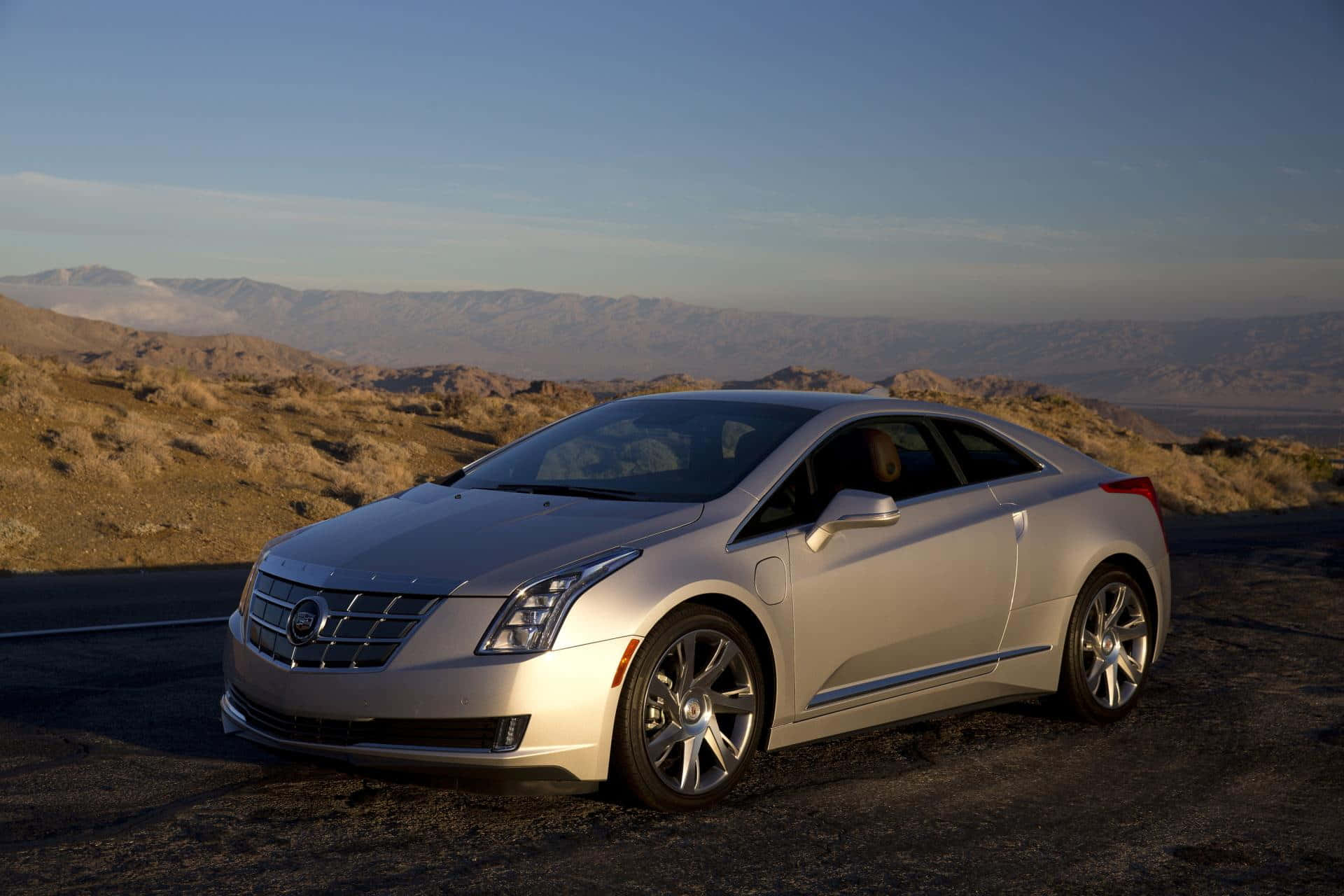 Sleek Cadillac ELR luxury electric coupe on the open road Wallpaper