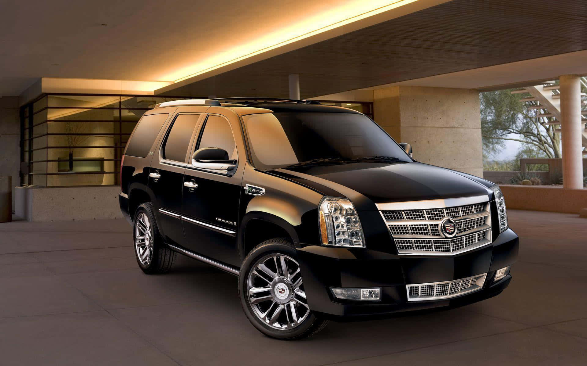 A Luxurious Cadillac Escalade on the Road Wallpaper