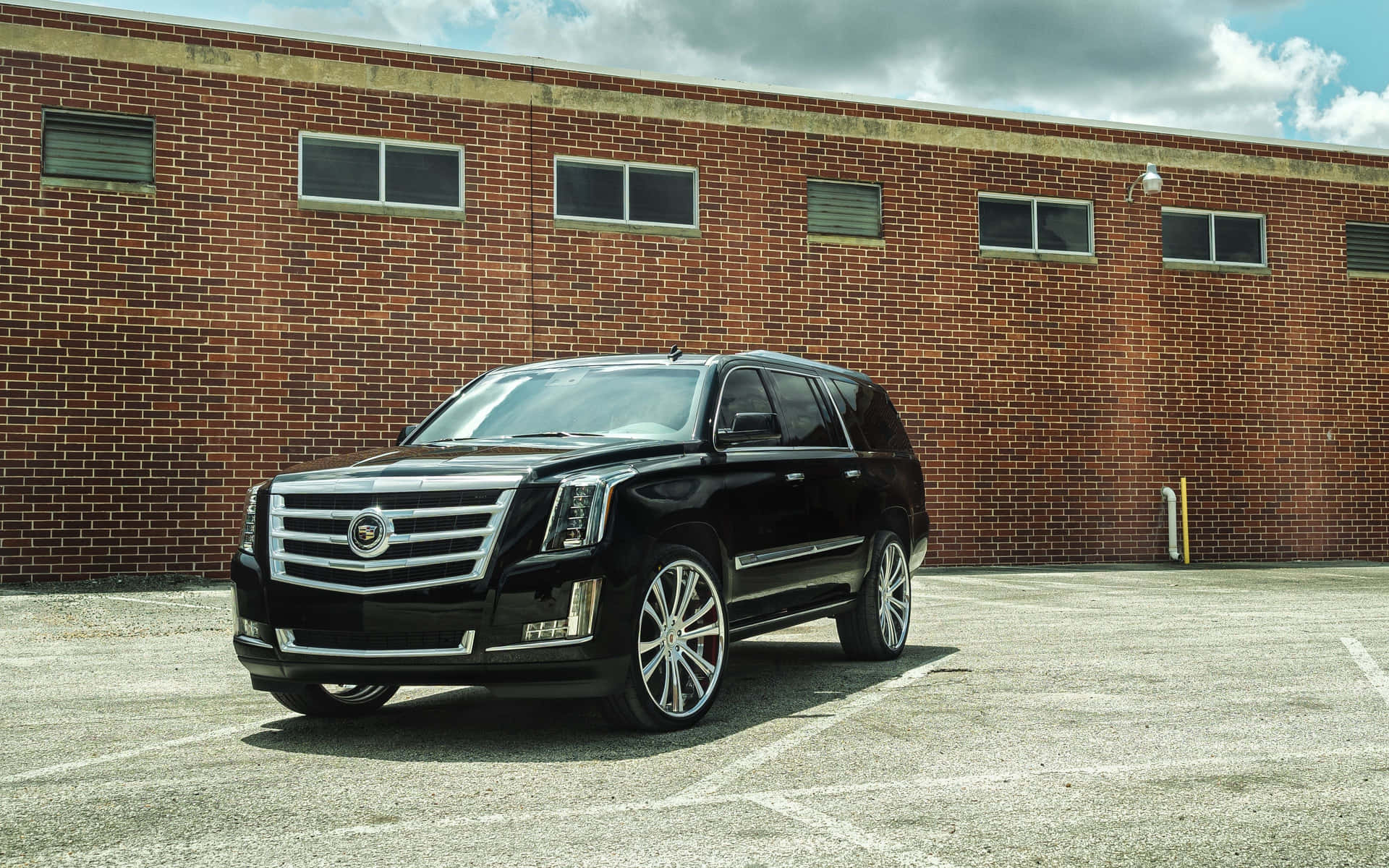 A Luxury Cadillac Escalade on the Road Wallpaper