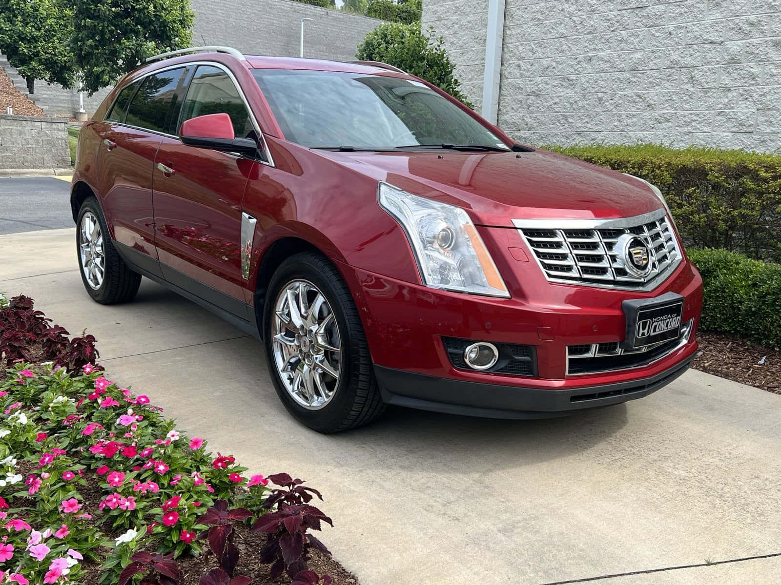 Caption: Sleek black Cadillac SRX on the road Wallpaper