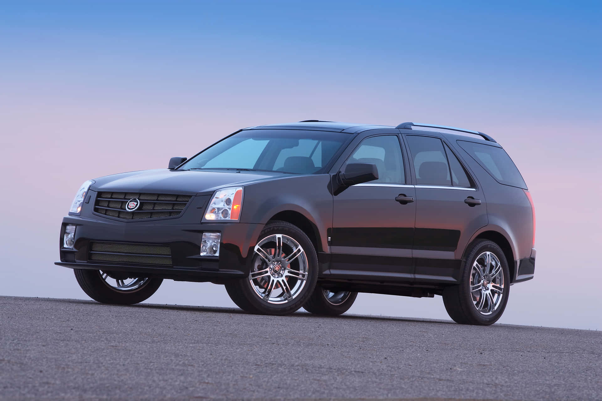 Caption: Stunning Cadillac SRX on the open road Wallpaper