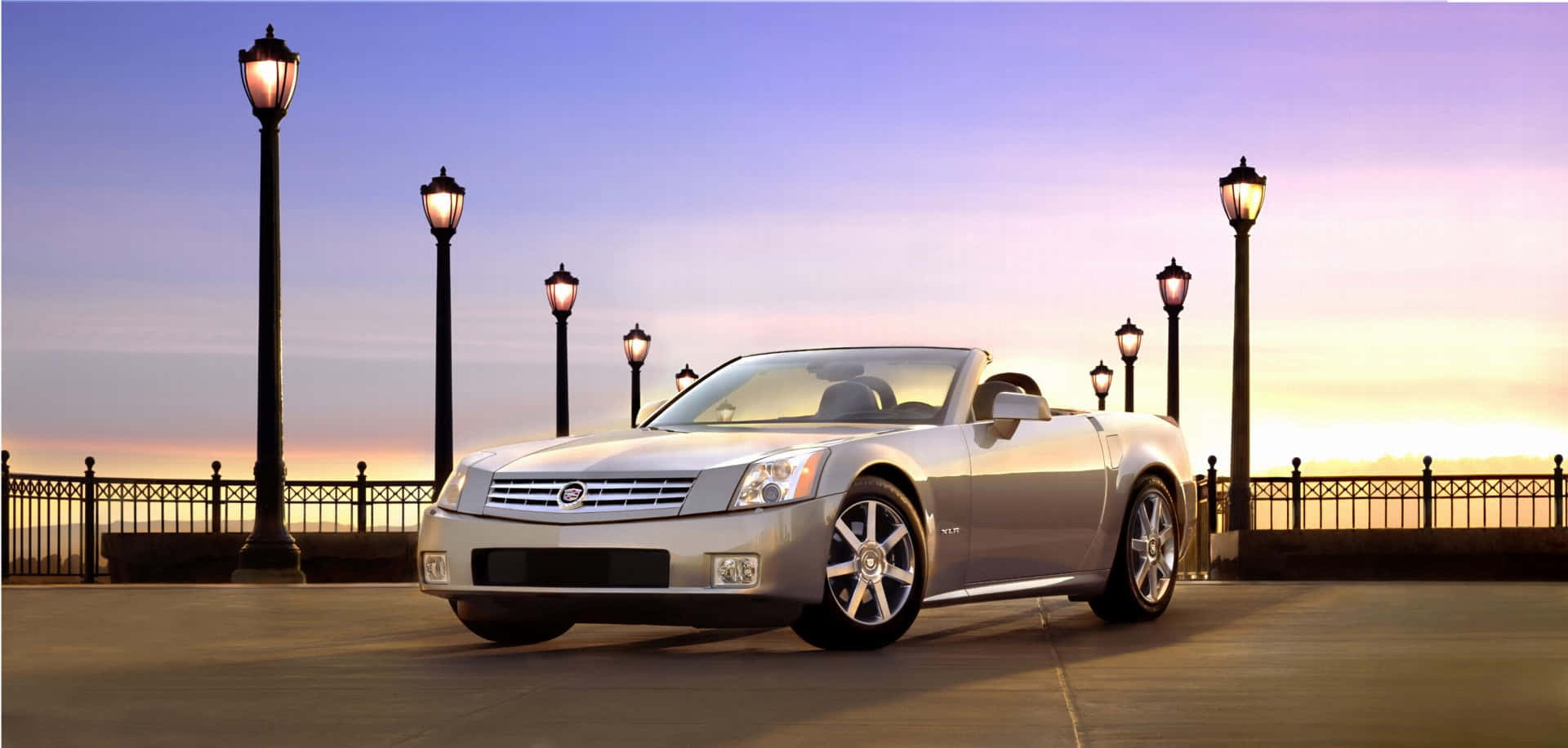 Sleek Cadillac XLR on Display in a Stunning Outdoor Setting Wallpaper