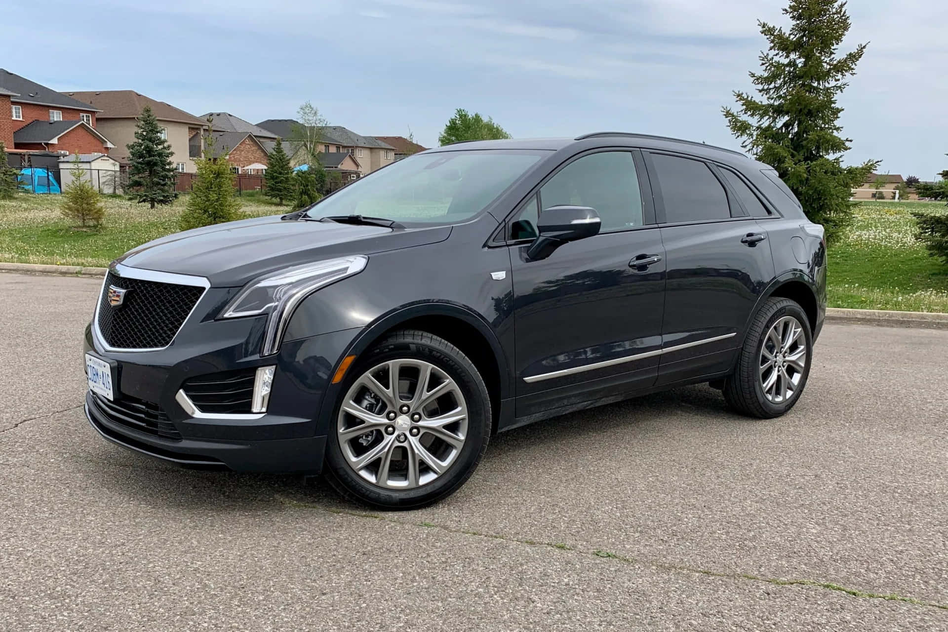 Sleek and Sophisticated Cadillac XT5 on Scenic Drive Wallpaper