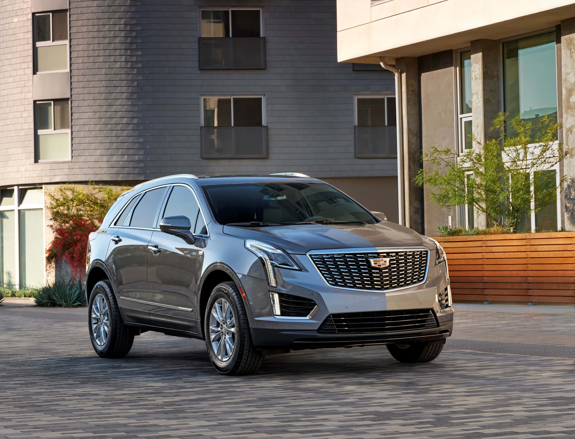 Sleek and Luxurious Cadillac XT5 in Action on the Highway Wallpaper