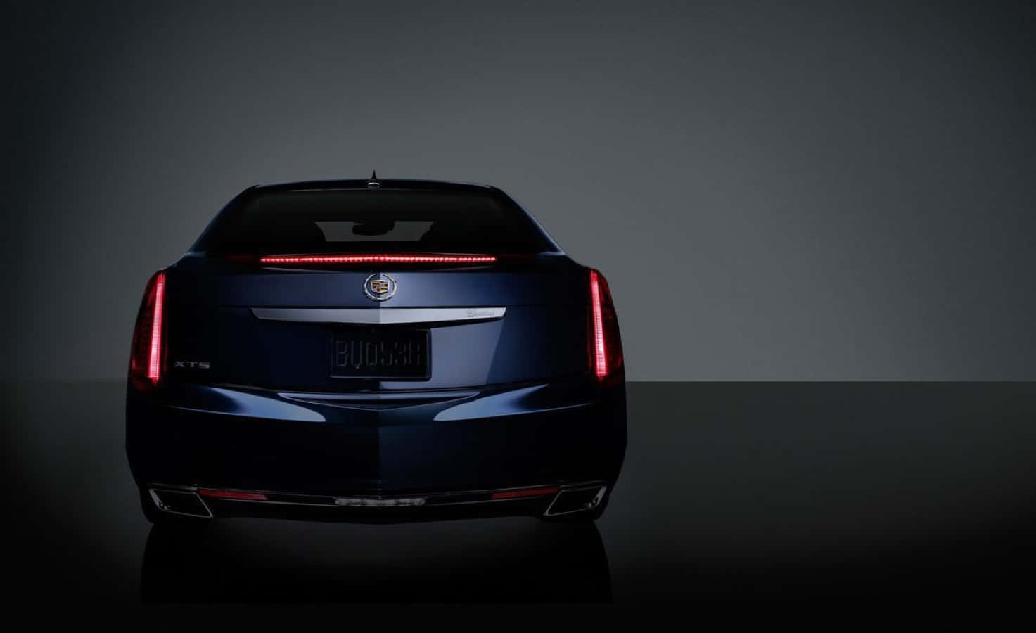 Sleek Cadillac XTS in Dramatic Lighting Wallpaper