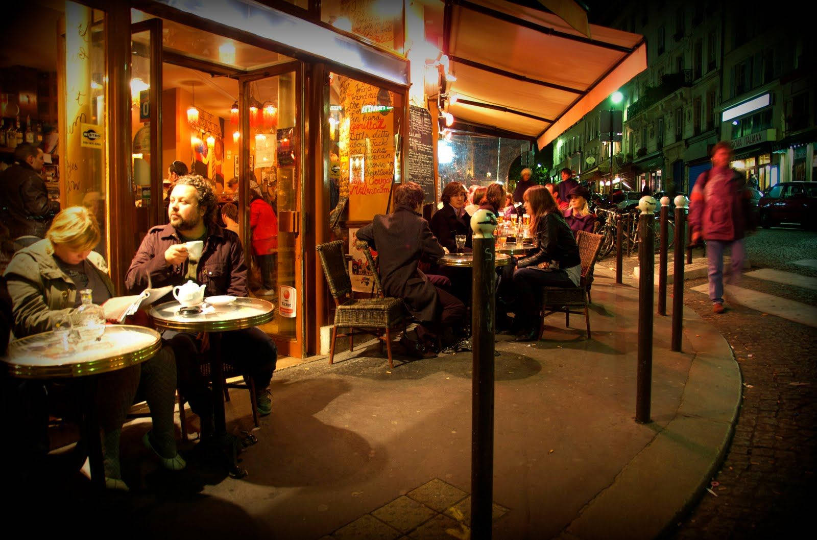 Cafe Filled With People At Night Picture