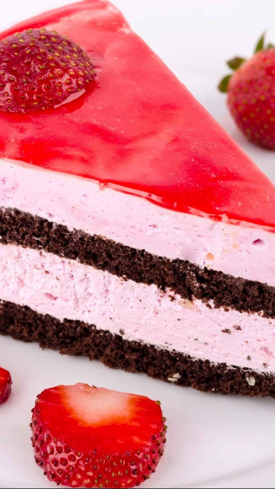 A Slice Of Strawberry Cake With Strawberries On Top Wallpaper