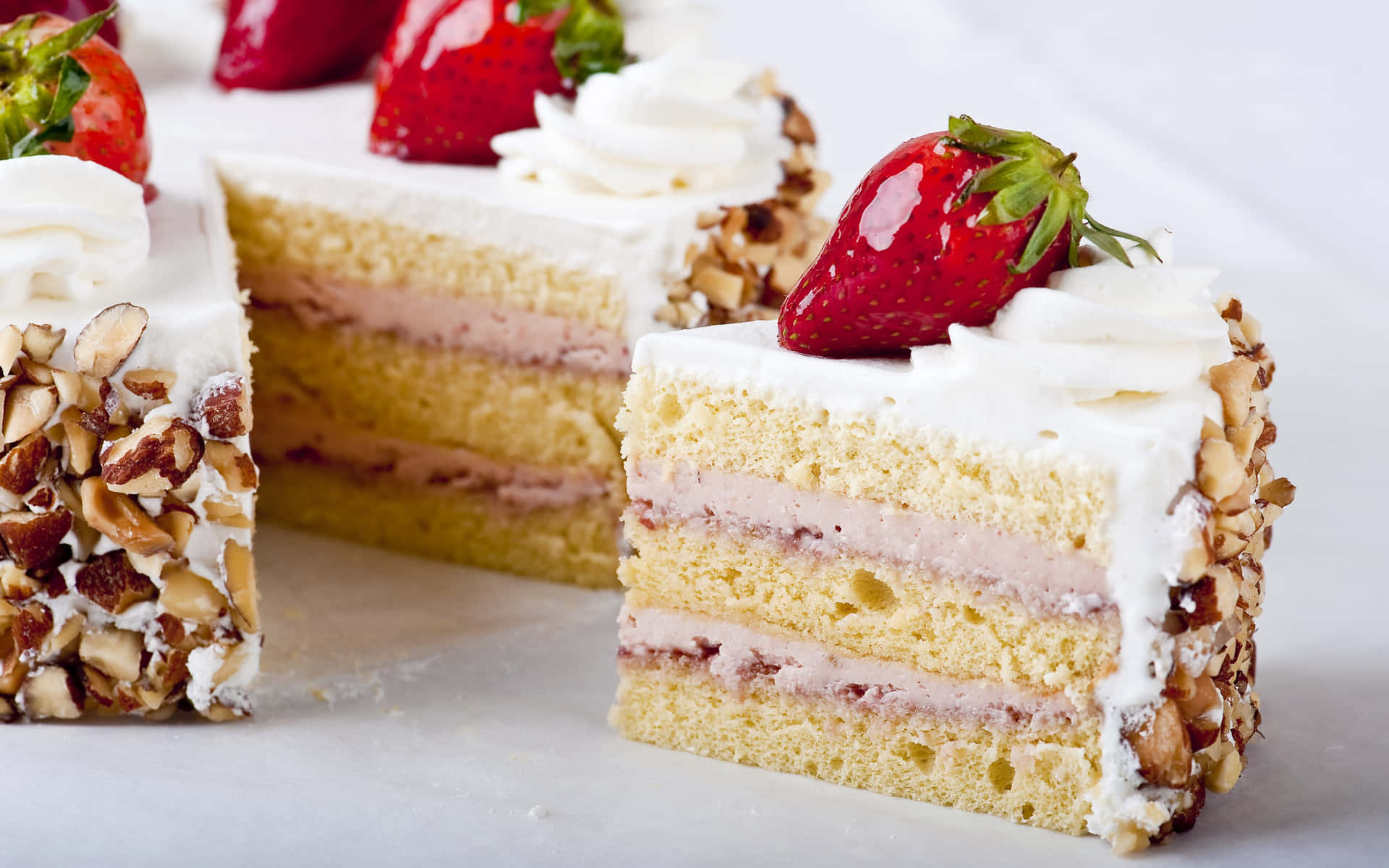 A Slice Of Cake With Strawberries And Almonds
