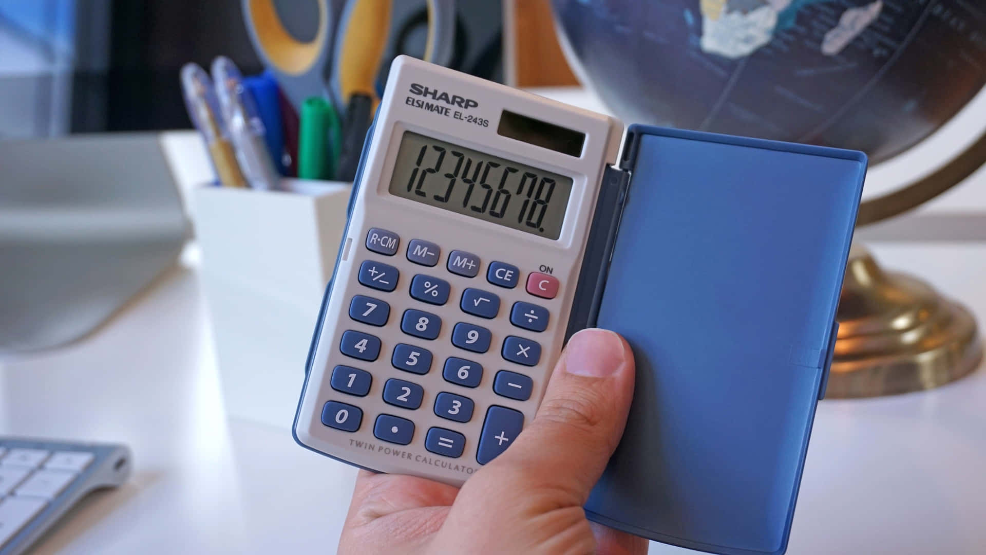 Modern Calculator on a Vibrant Blue Background