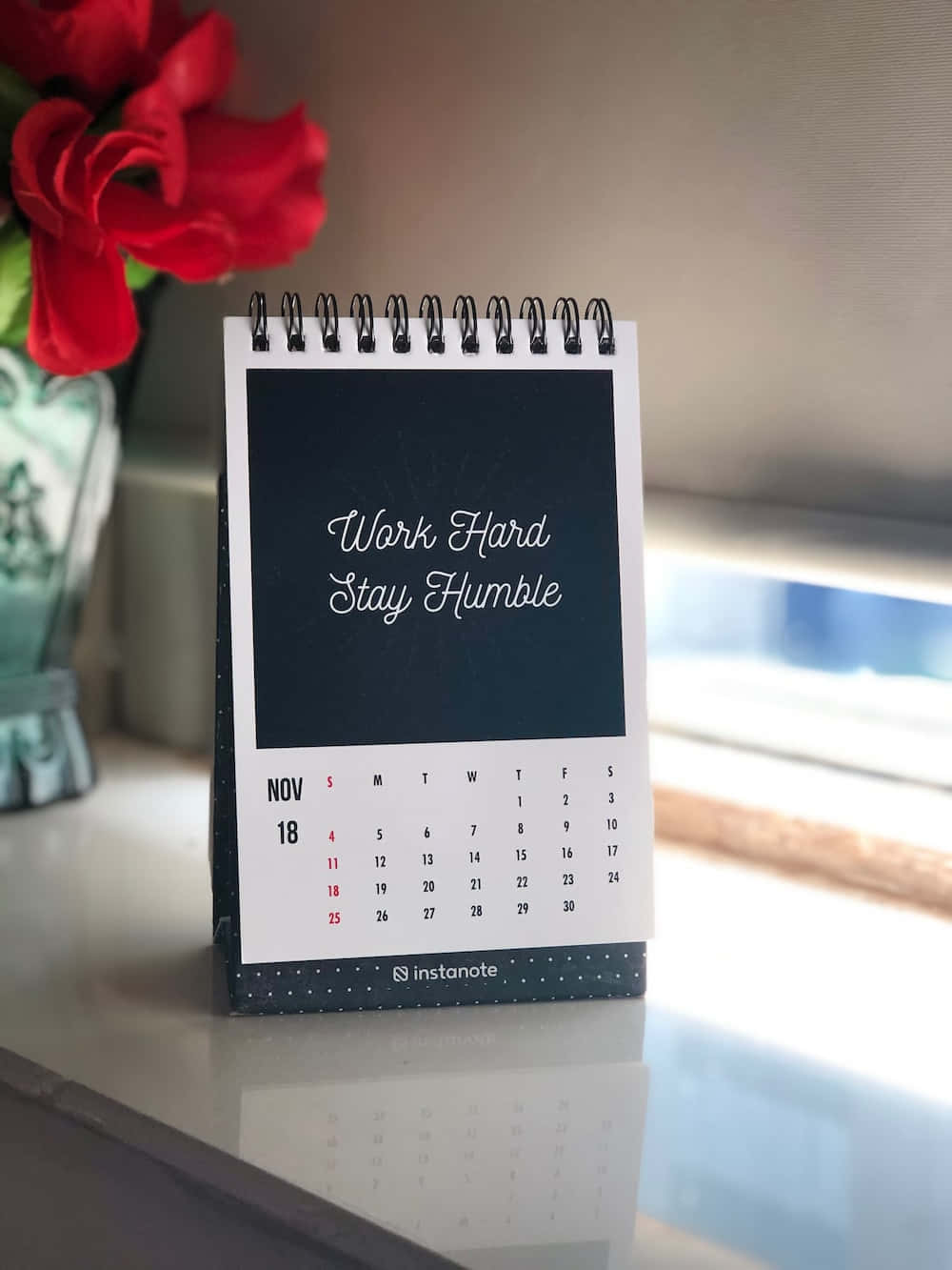 A Calendar With A Flower On It