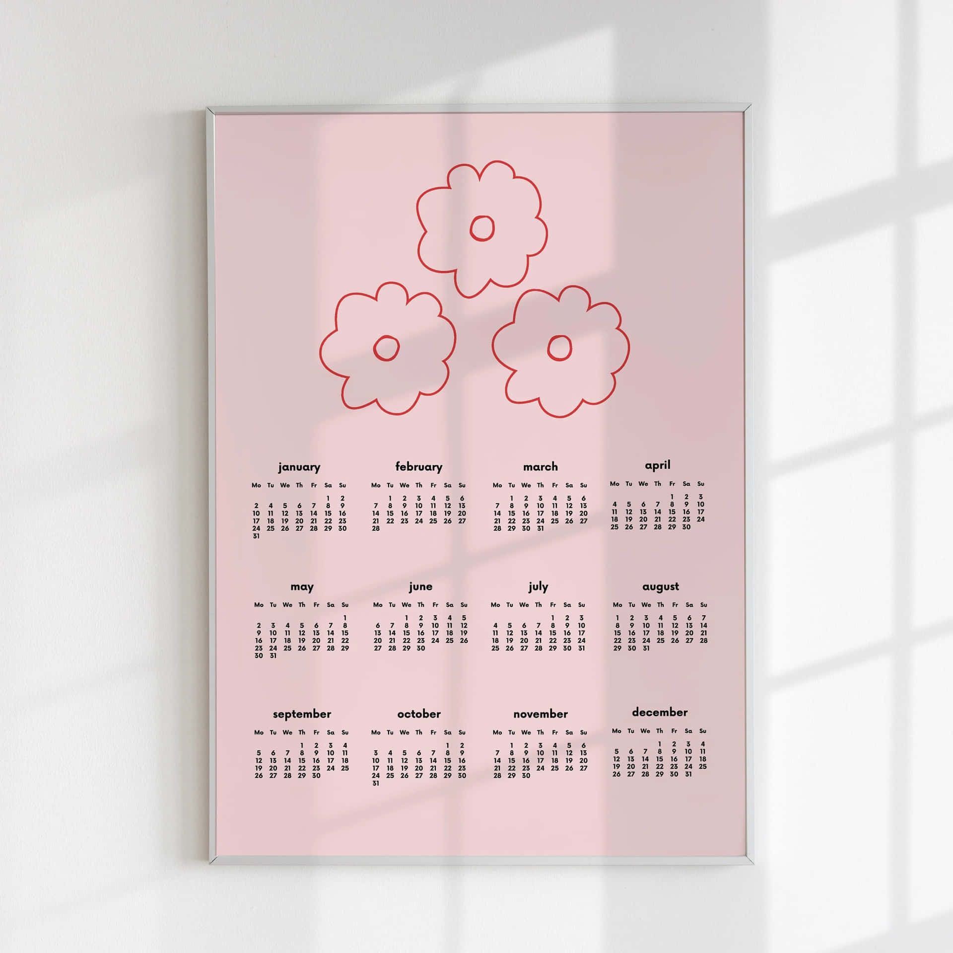 A Pink Calendar With Flowers On It