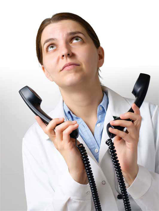 A Woman Holding Two Telephones