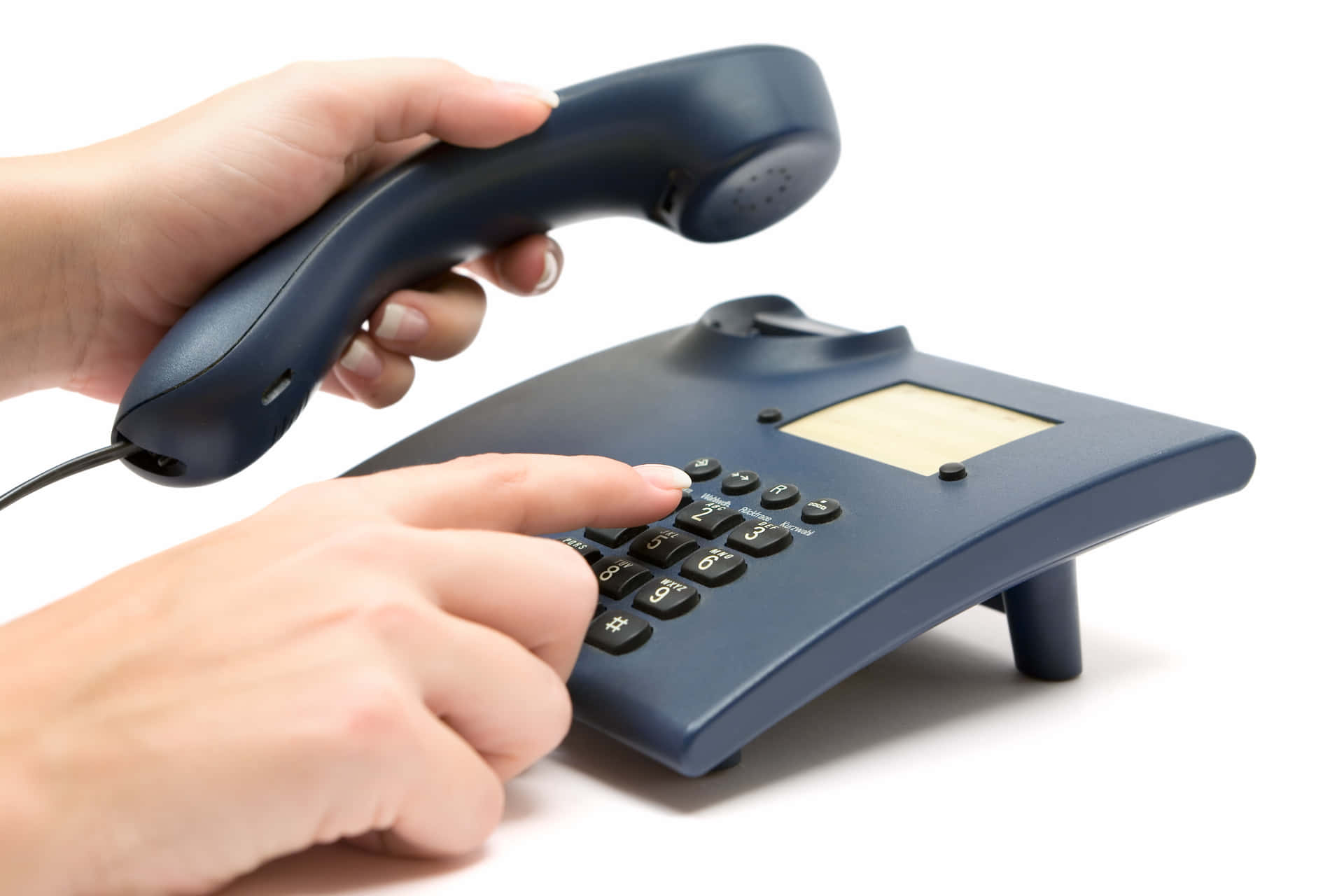 A Person Is Holding A Telephone And Pressing The Button