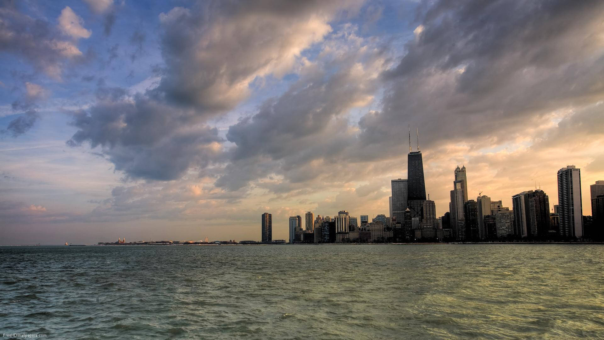 Calm Ocean Under Cloudy Chicago Skyline Wallpaper