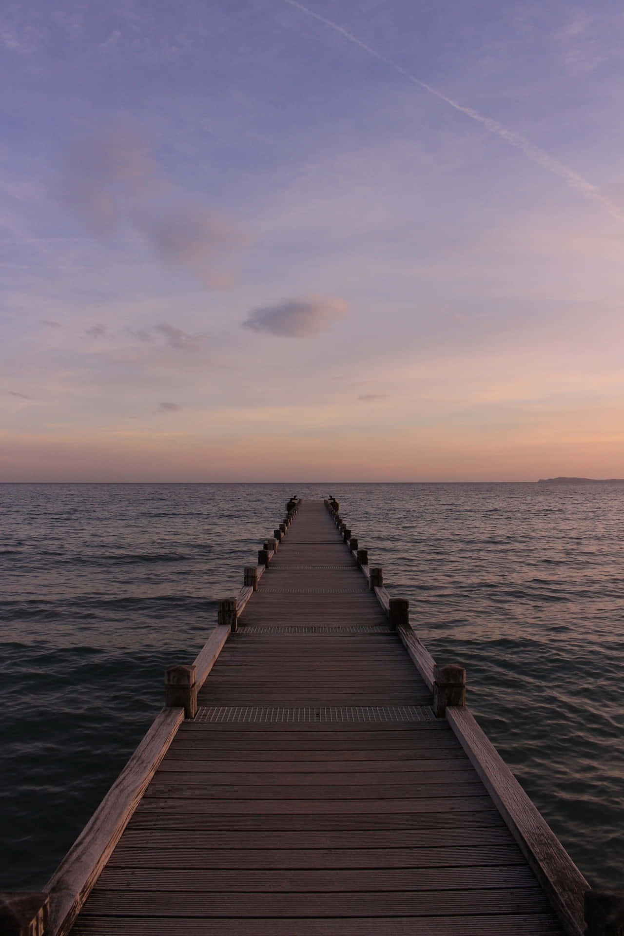 A Wooden Pier In The Water