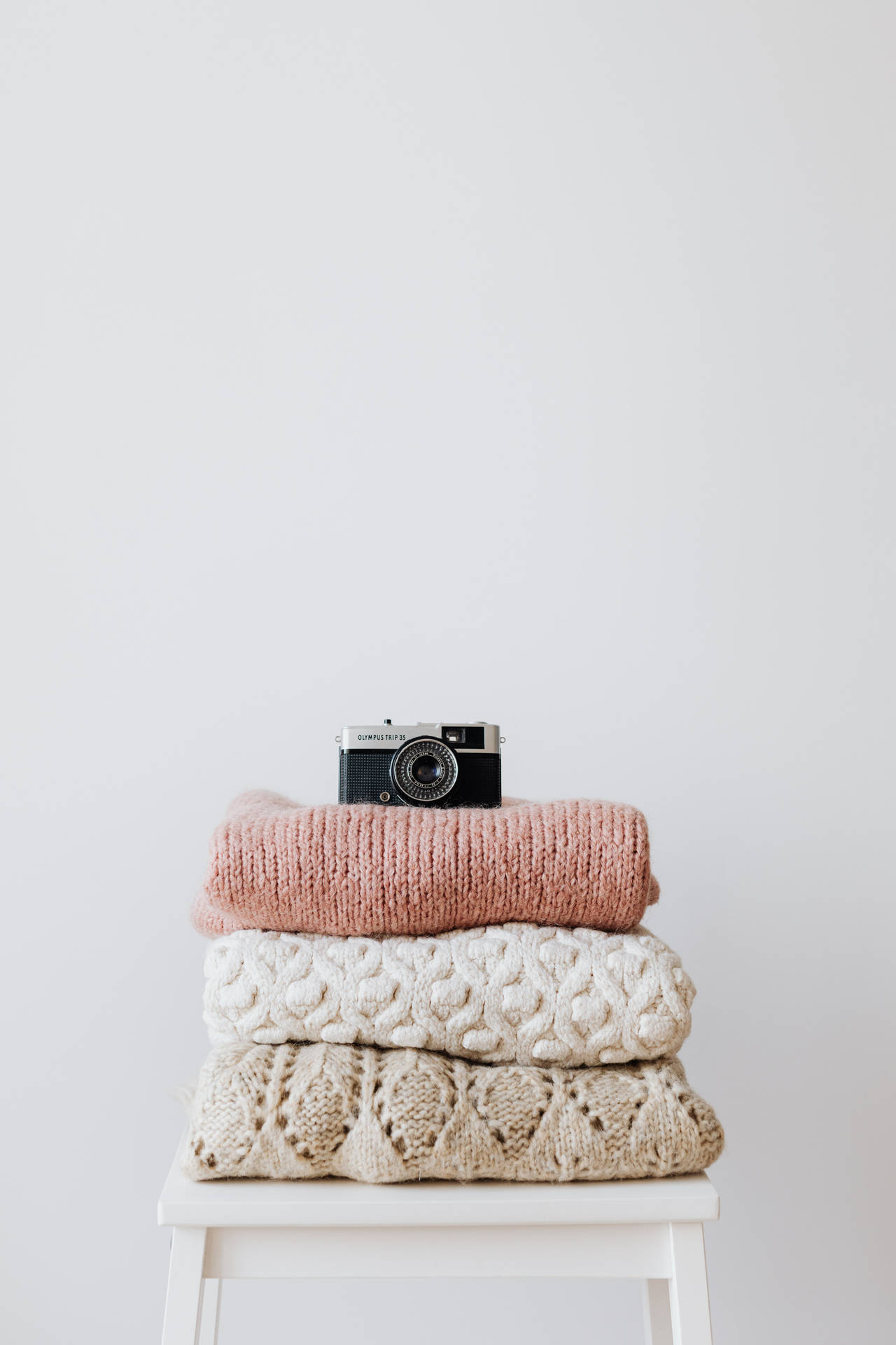 Camera Above Knitted Sweatshirt Wallpaper