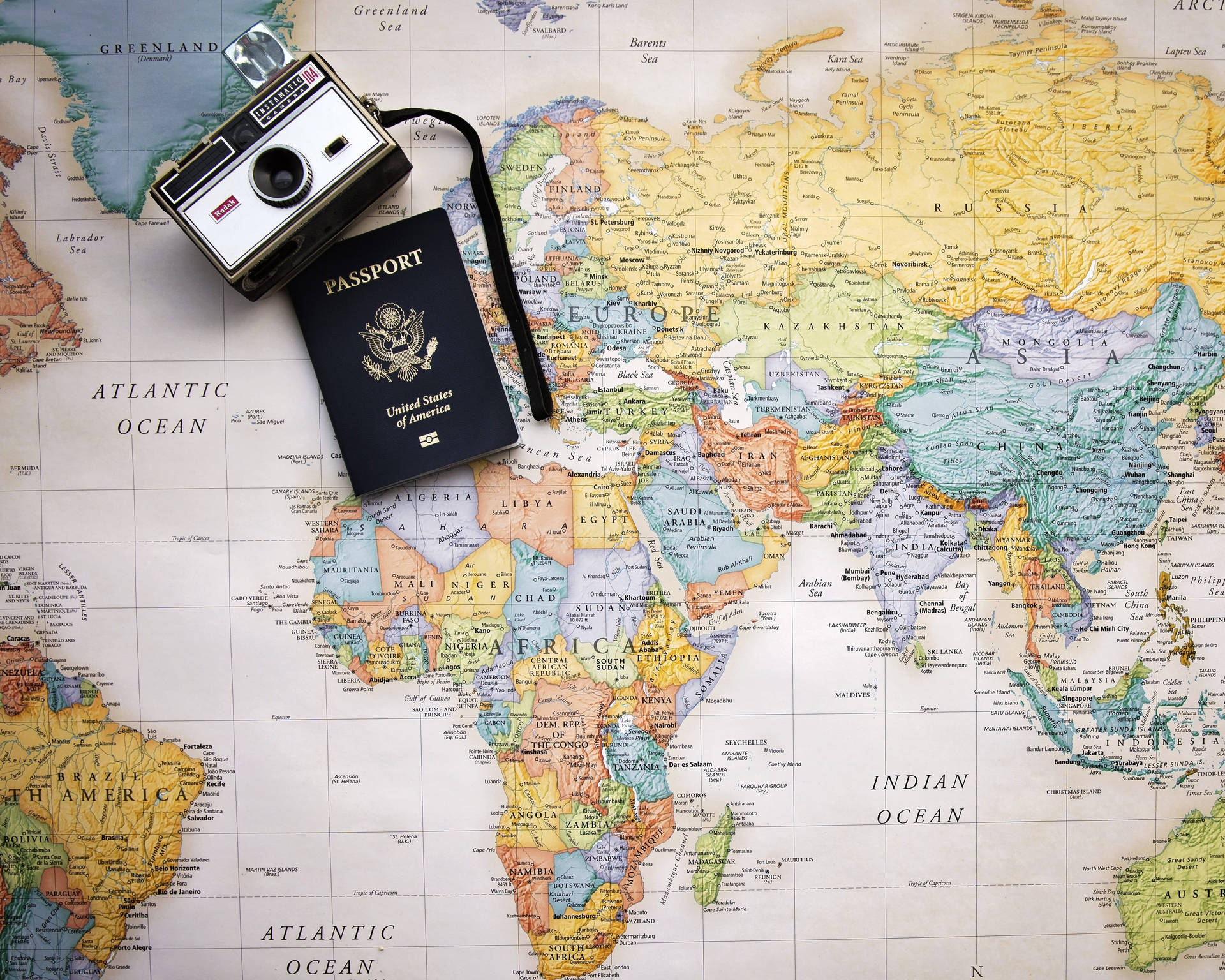 Camera And Passport World Map 4k Wallpaper