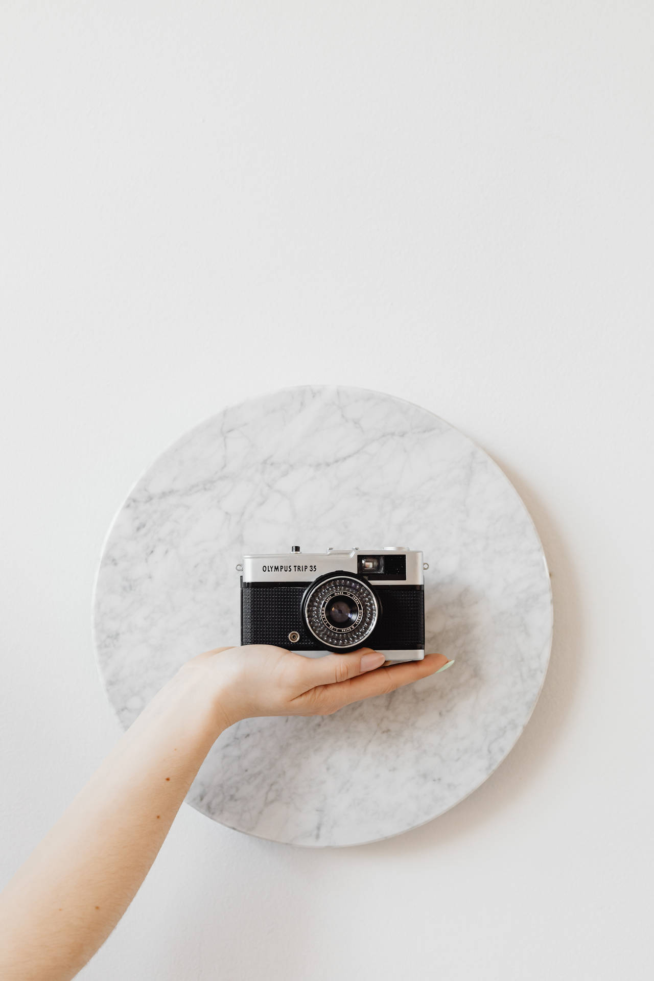 Camera On Round Marble Wallpaper