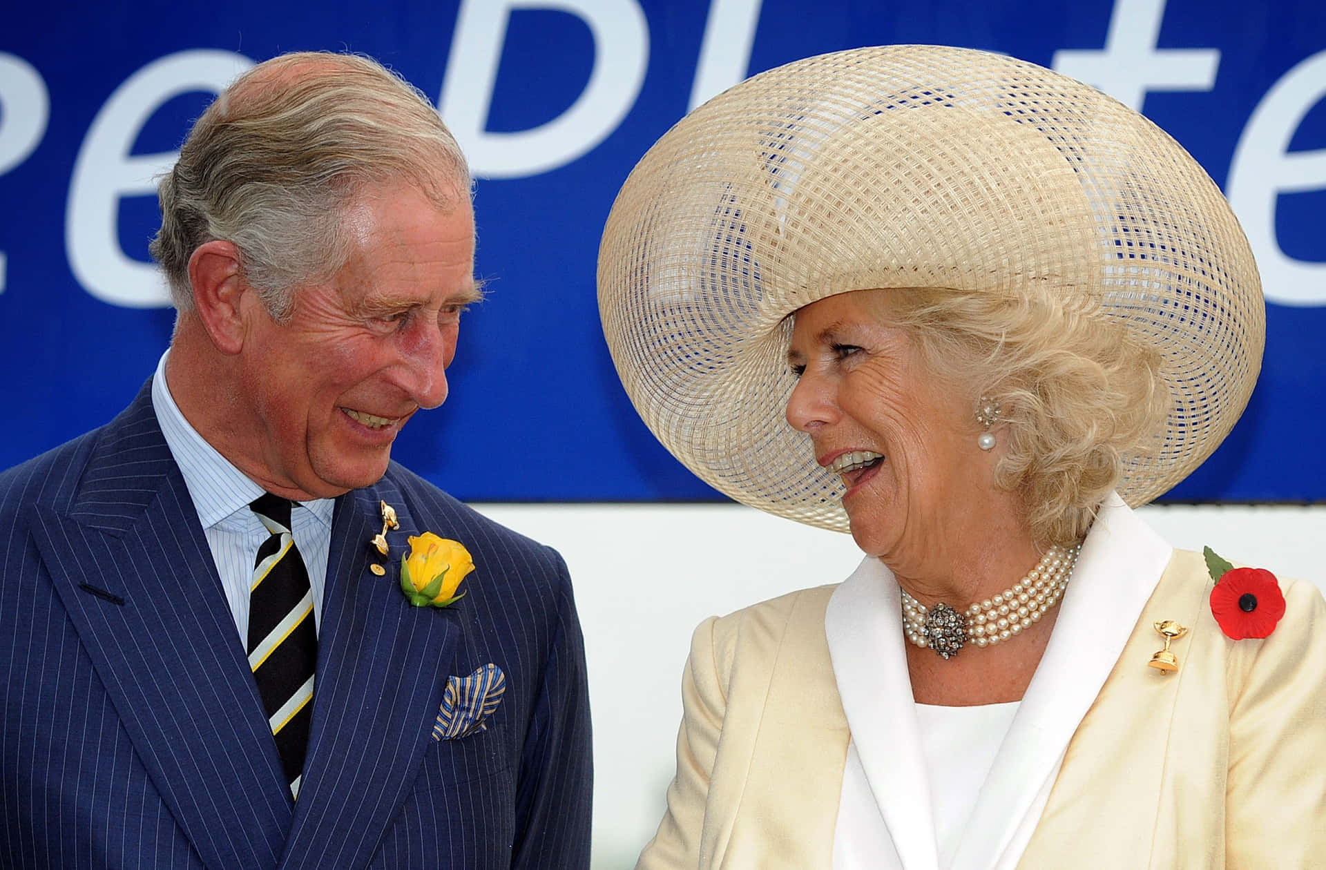 A Heartwarming moment of Camilla Laughing with Charles Wallpaper